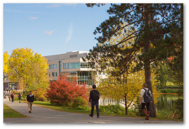 Students walking near pond and Integrative Learning Center